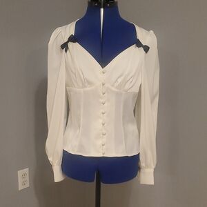 Chic Cream Blouse With Black Bow Accents